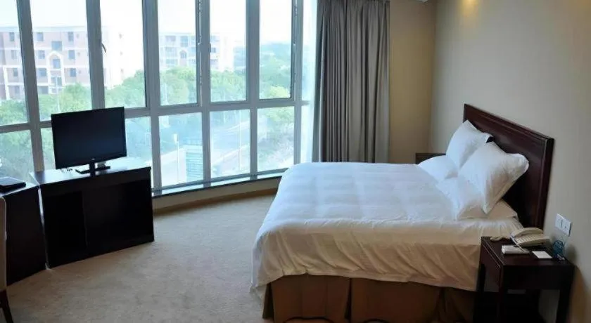 Bed in GreenTree Inn Shanghai Songjiang Xinqiao Jiuxin Road Express Hotel