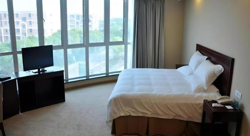 Bed in GreenTree Inn Shanghai Songjiang Xinqiao Jiuxin Road Express Hotel