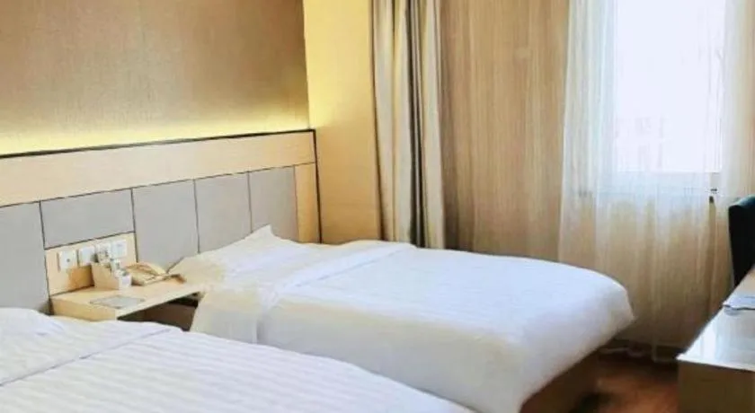 Bed in GreenTree Inn Shanghai Songjiang Xinqiao Jiuxin Road Express Hotel