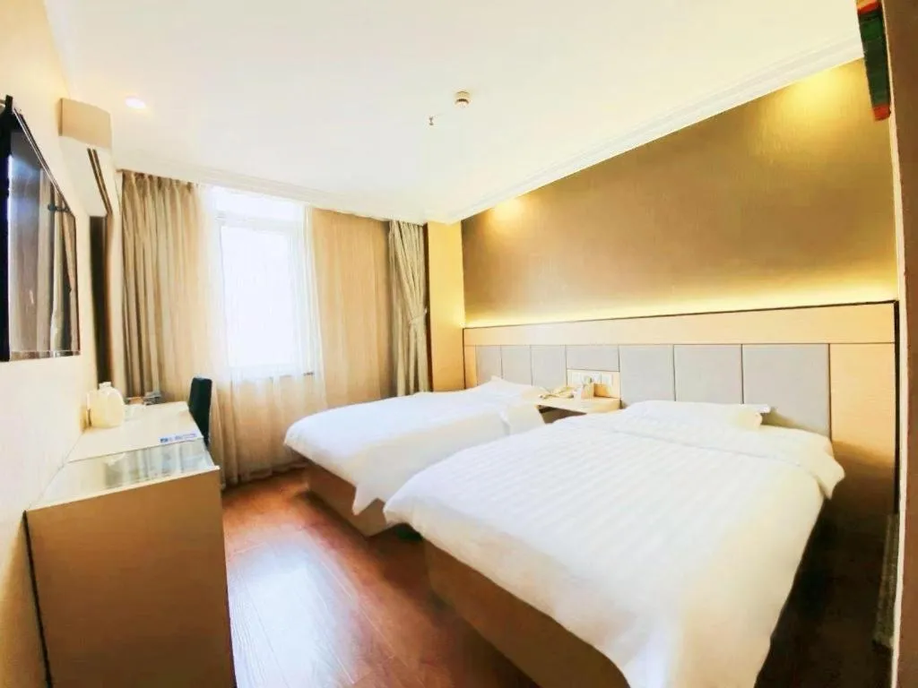 Bed in GreenTree Inn Shanghai Songjiang Xinqiao Jiuxin Road Express Hotel