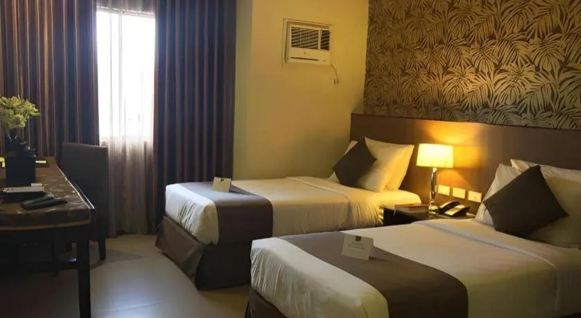 Bed in GT Hotel Bacolod