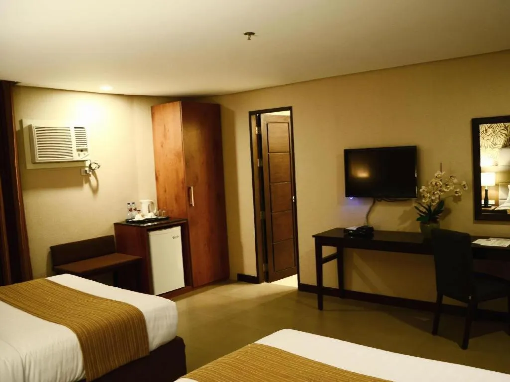 Bed in GT Hotel Bacolod