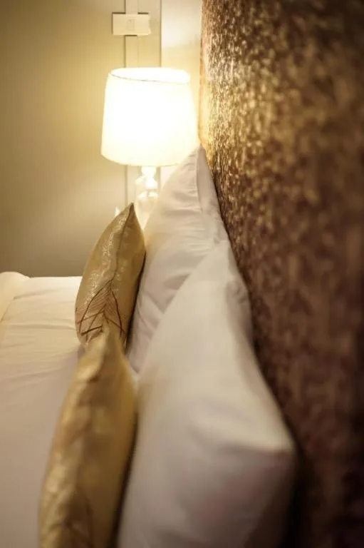 Bed in Winhouse Hotel