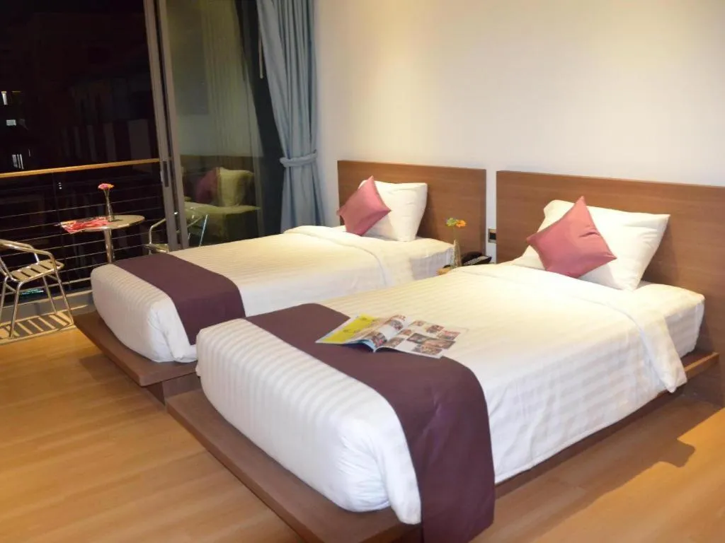 Bed in The Scenery City Hotel