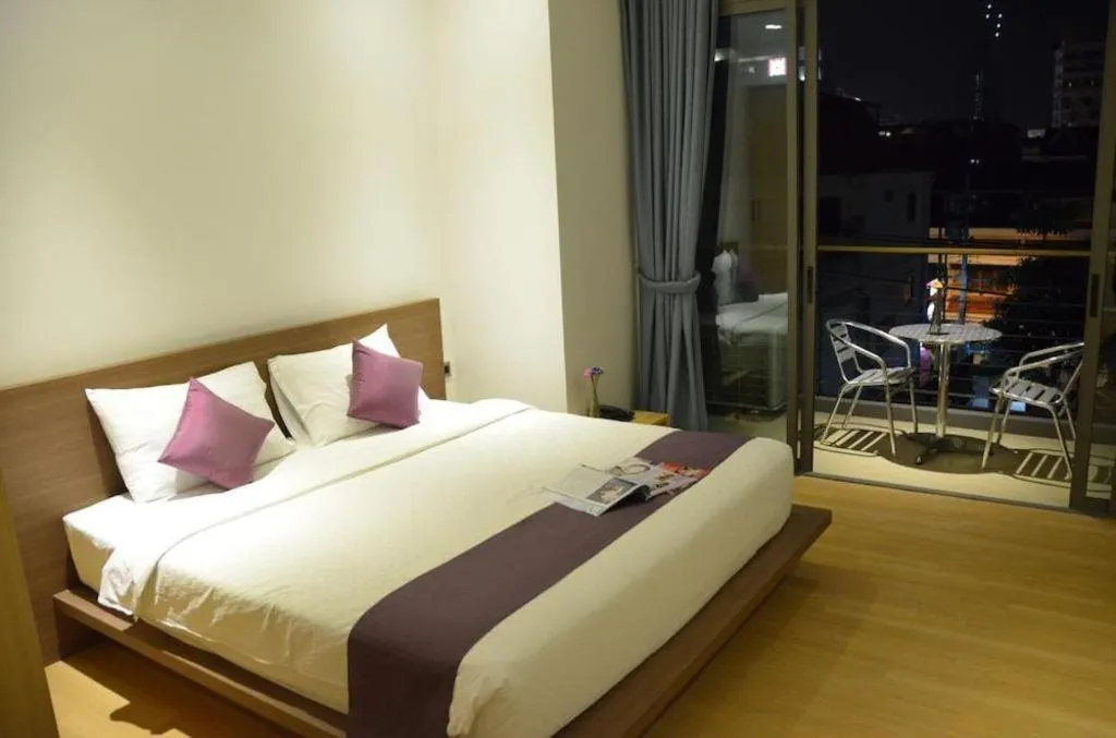 Bed in The Scenery City Hotel