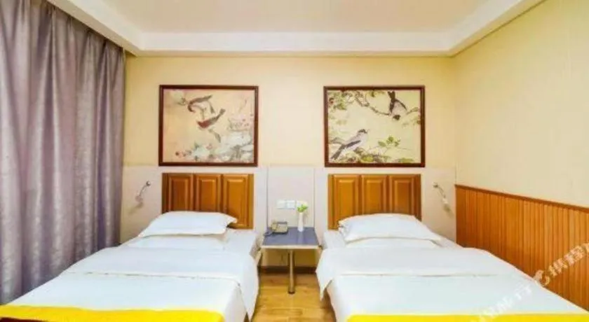 Bed in Kunlun Leju Business Hotel Kaifeng Gulou