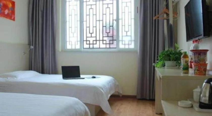 Bed in Kunlun Leju Business Hotel Kaifeng Gulou