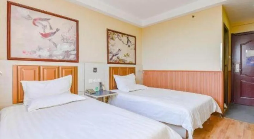 Bed in Kunlun Leju Business Hotel Kaifeng Gulou