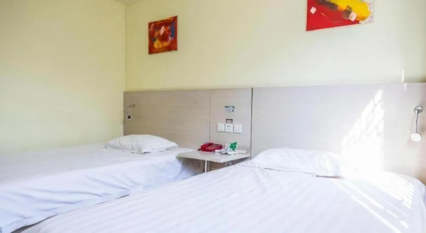 Bed in Kunlun Leju Business Hotel Kaifeng Gulou