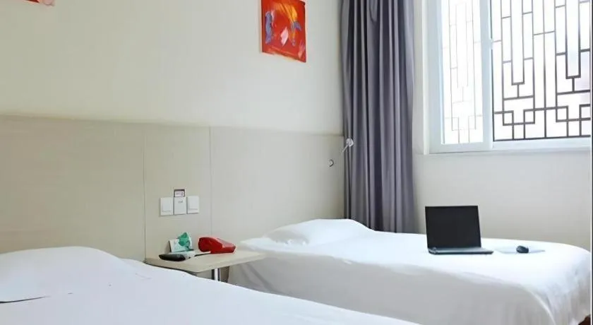 Bed in Kunlun Leju Business Hotel Kaifeng Gulou