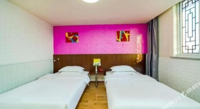 Bed in Kunlun Leju Business Hotel Kaifeng Gulou