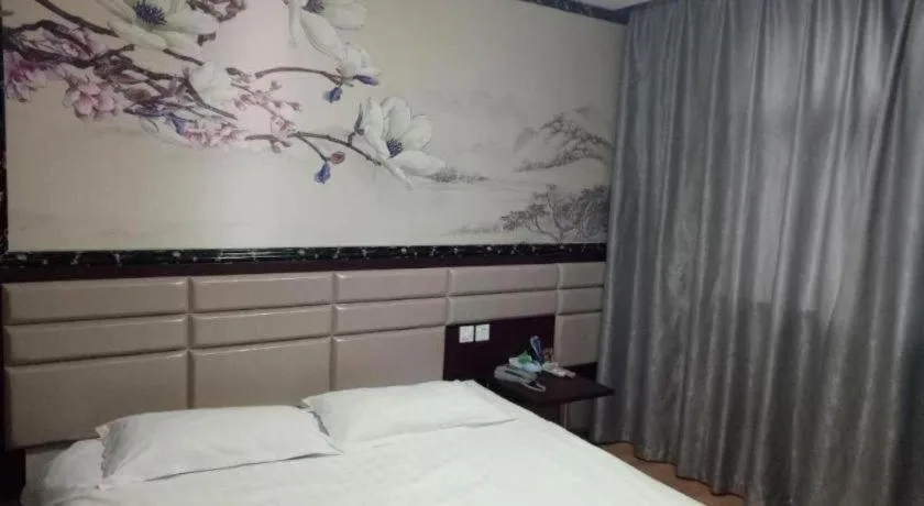 Bed in Kunlun Leju Business Hotel Kaifeng Gulou