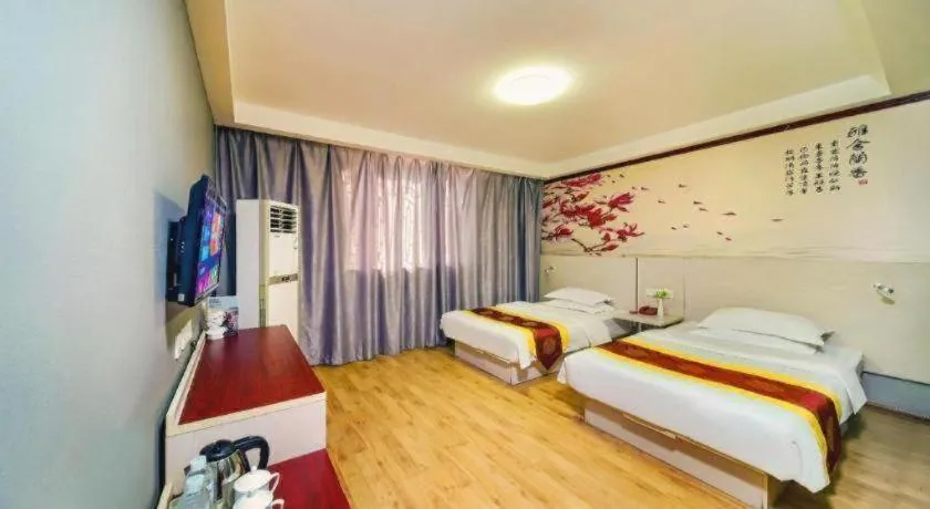 Bed in Kunlun Leju Business Hotel Kaifeng Gulou