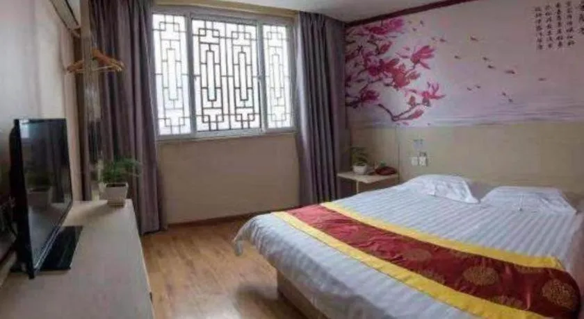 Bed in Kunlun Leju Business Hotel Kaifeng Gulou