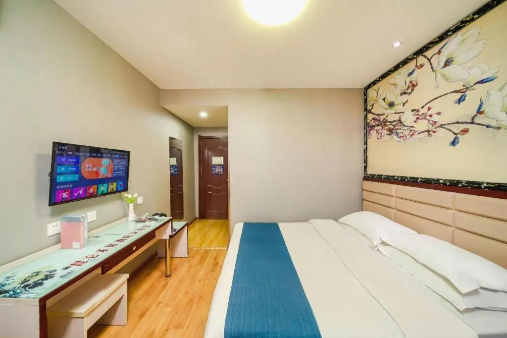Bed in Kunlun Leju Business Hotel Kaifeng Gulou