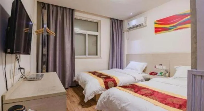 Bed in Kunlun Leju Business Hotel Kaifeng Gulou