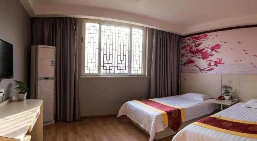 Bed in Kunlun Leju Business Hotel Kaifeng Gulou