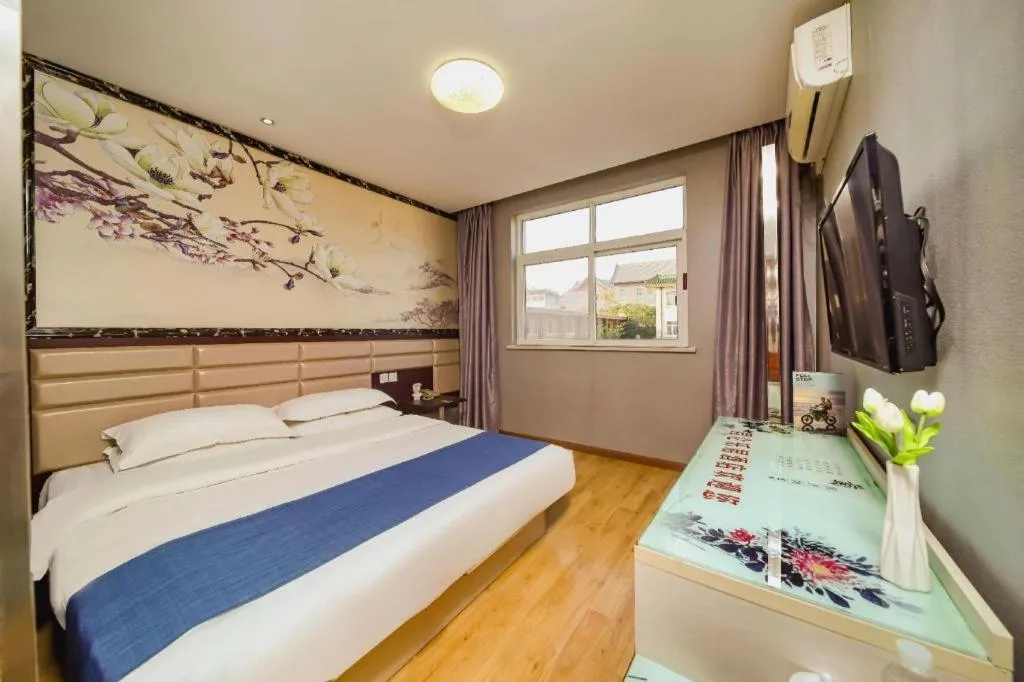 Bed in Kunlun Leju Business Hotel Kaifeng Gulou