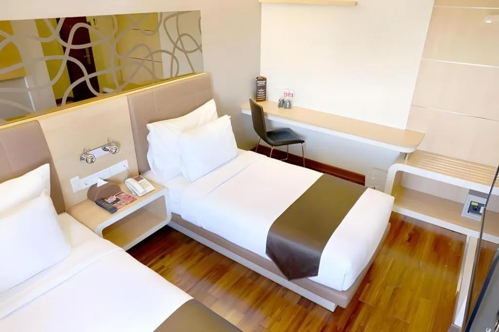 Bed in Sub City Hotel