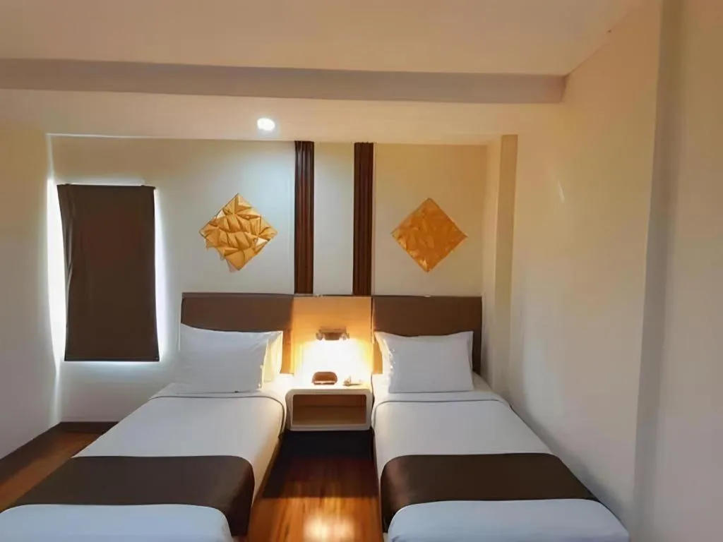 Bed in Sub City Hotel