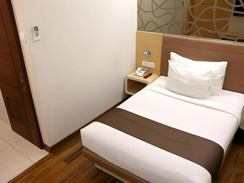 Bed in Sub City Hotel