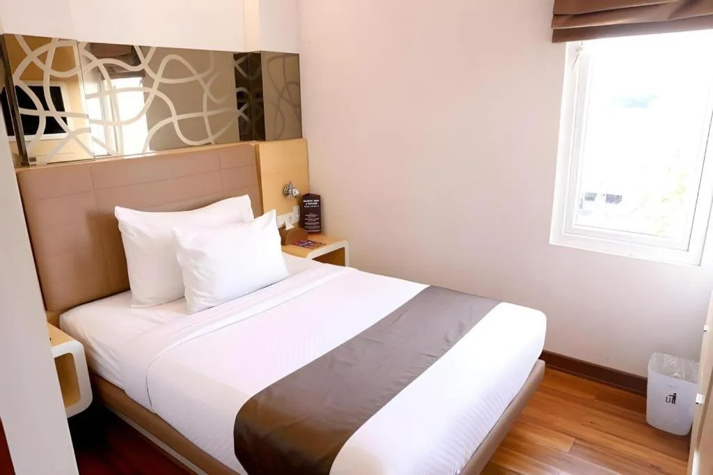 Bed in Sub City Hotel