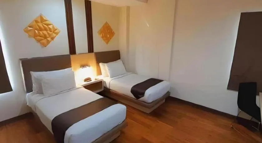 Bed in Sub City Hotel