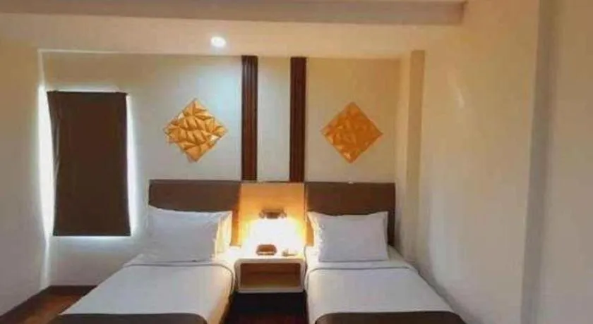 Bed in Sub City Hotel