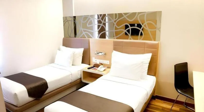 Bed in Sub City Hotel