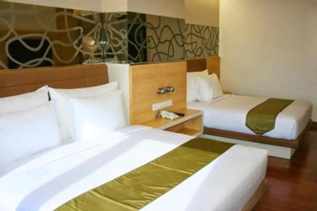 Bed in Sub City Hotel