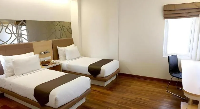 Bed in Sub City Hotel