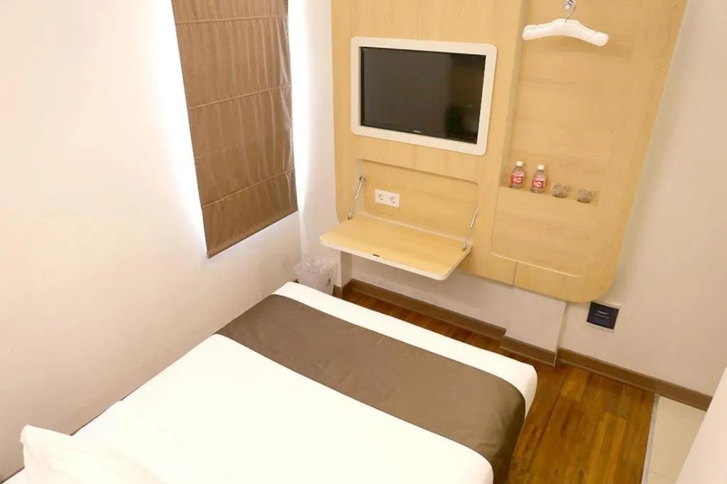 Bed in Sub City Hotel