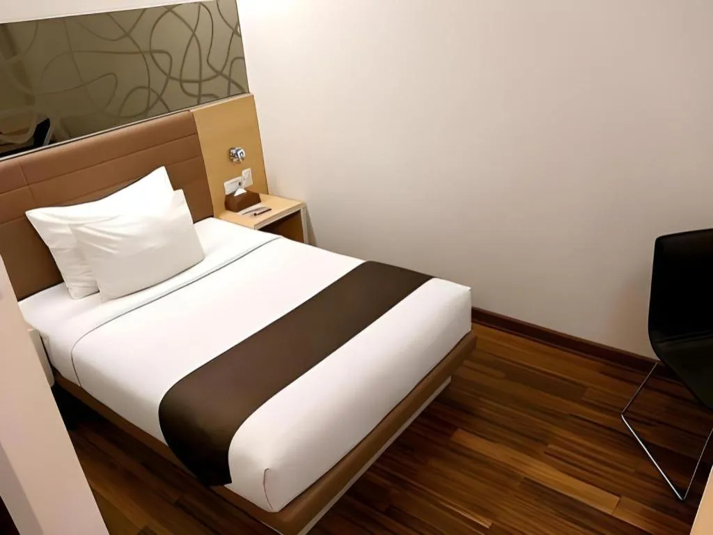 Bed in Sub City Hotel