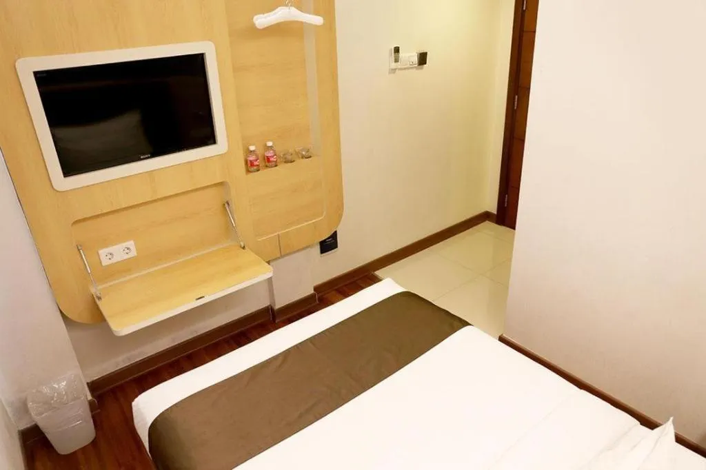 Bed in Sub City Hotel