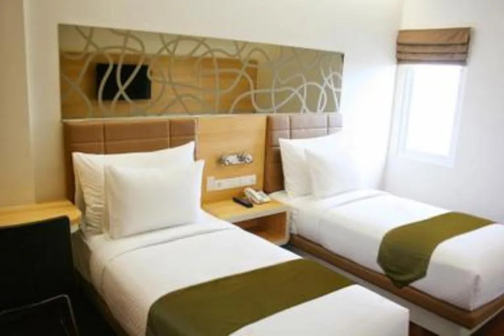 Bed in Sub City Hotel