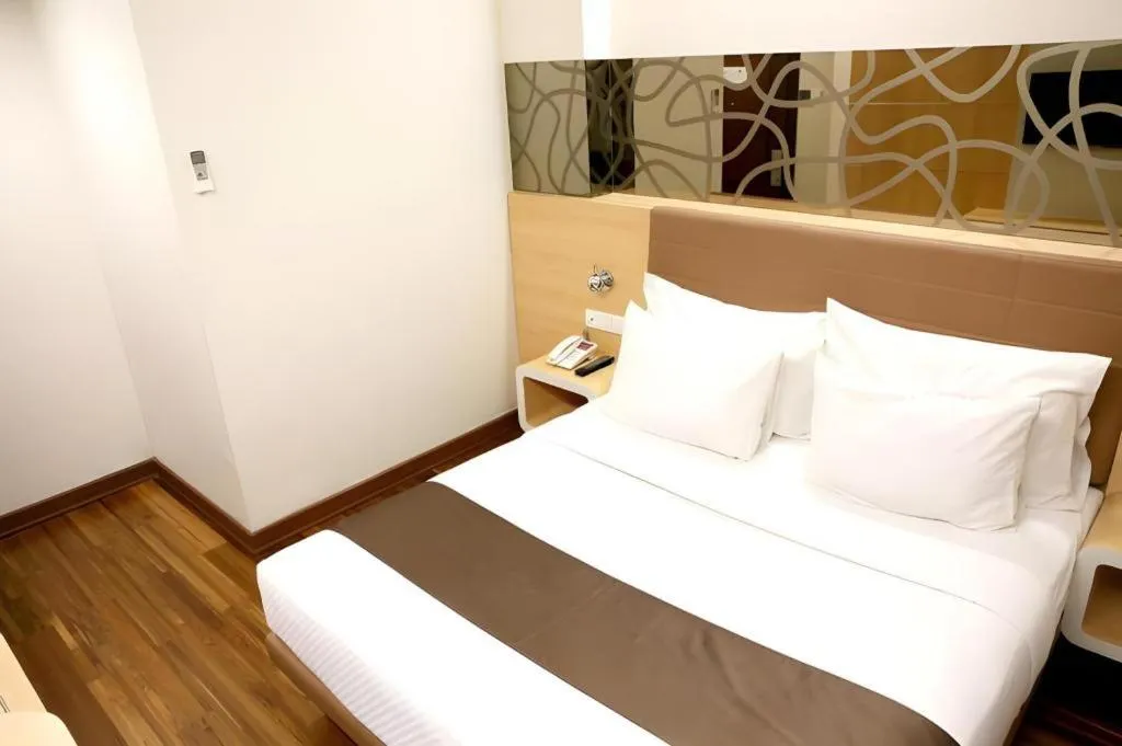 Bed in Sub City Hotel