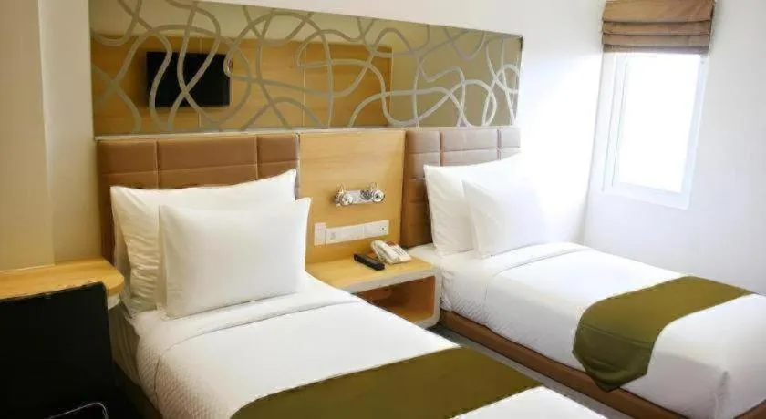 Bed in Sub City Hotel