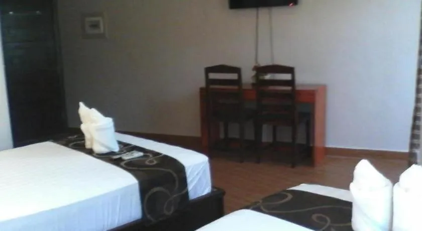 Bed in Rovic's Tourist Hotel