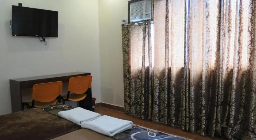 Bed in Rovic's Tourist Hotel