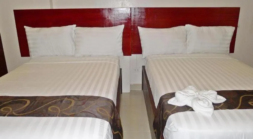 Bed in Rovic's Tourist Hotel