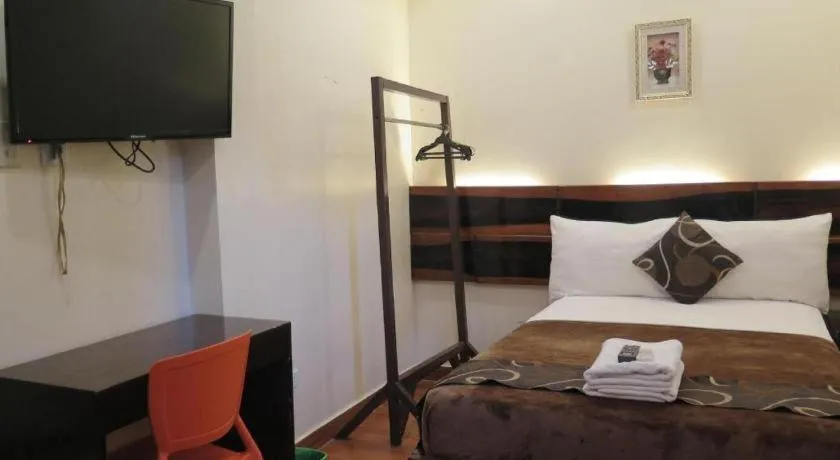 Bed in Rovic's Tourist Hotel