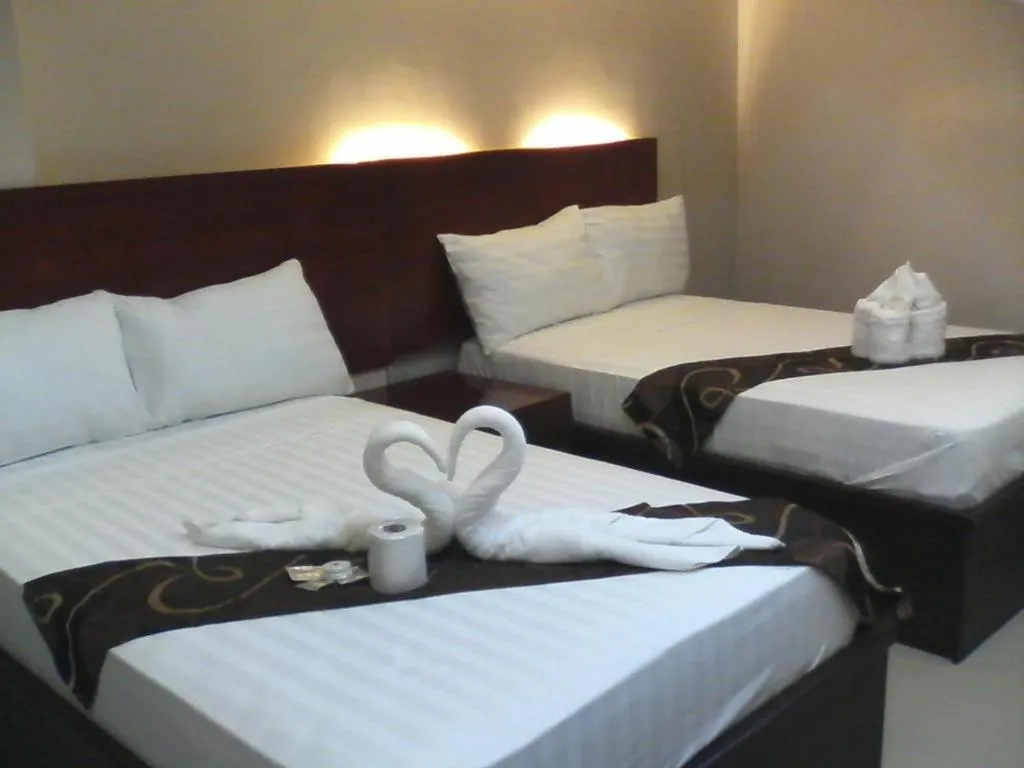 Bed in Rovic's Tourist Hotel