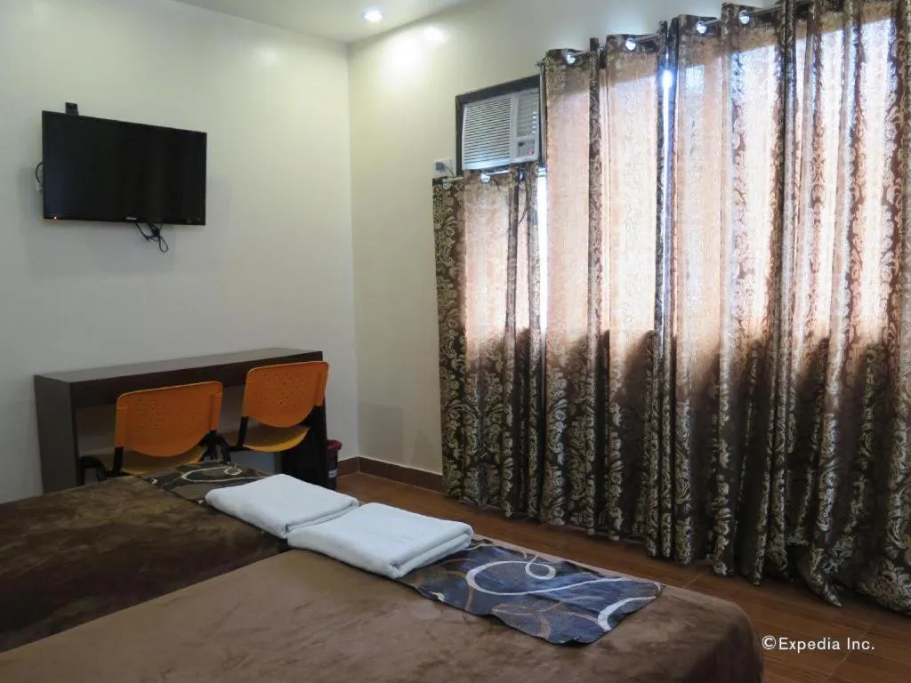 Bed in Rovic's Tourist Hotel