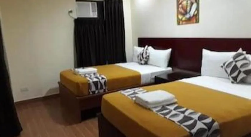 Bed in Rovic's Tourist Hotel