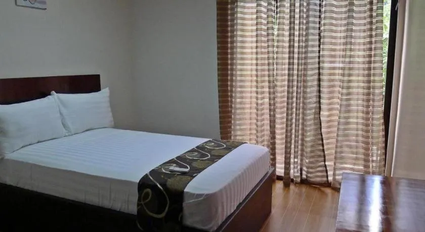 Bed in Rovic's Tourist Hotel