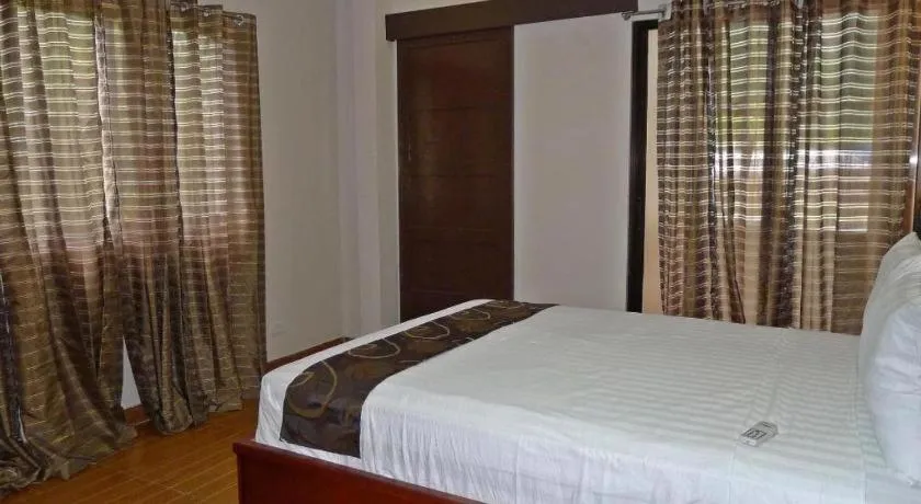 Bed in Rovic's Tourist Hotel