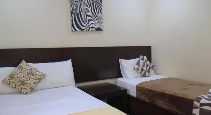 Bed in Rovic's Tourist Hotel