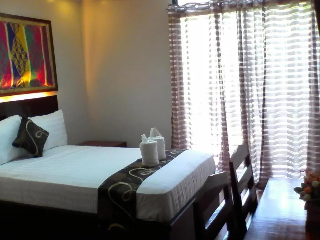 Bed in Rovic's Tourist Hotel