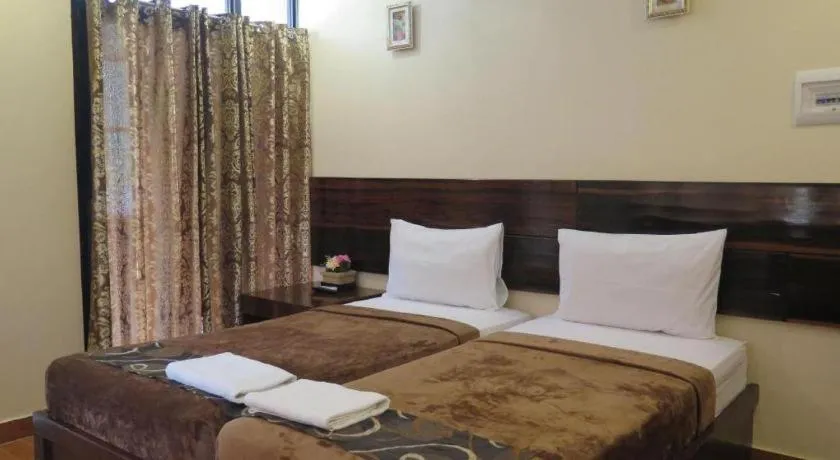 Bed in Rovic's Tourist Hotel