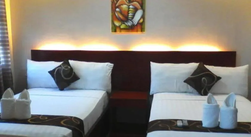 Bed in Rovic's Tourist Hotel